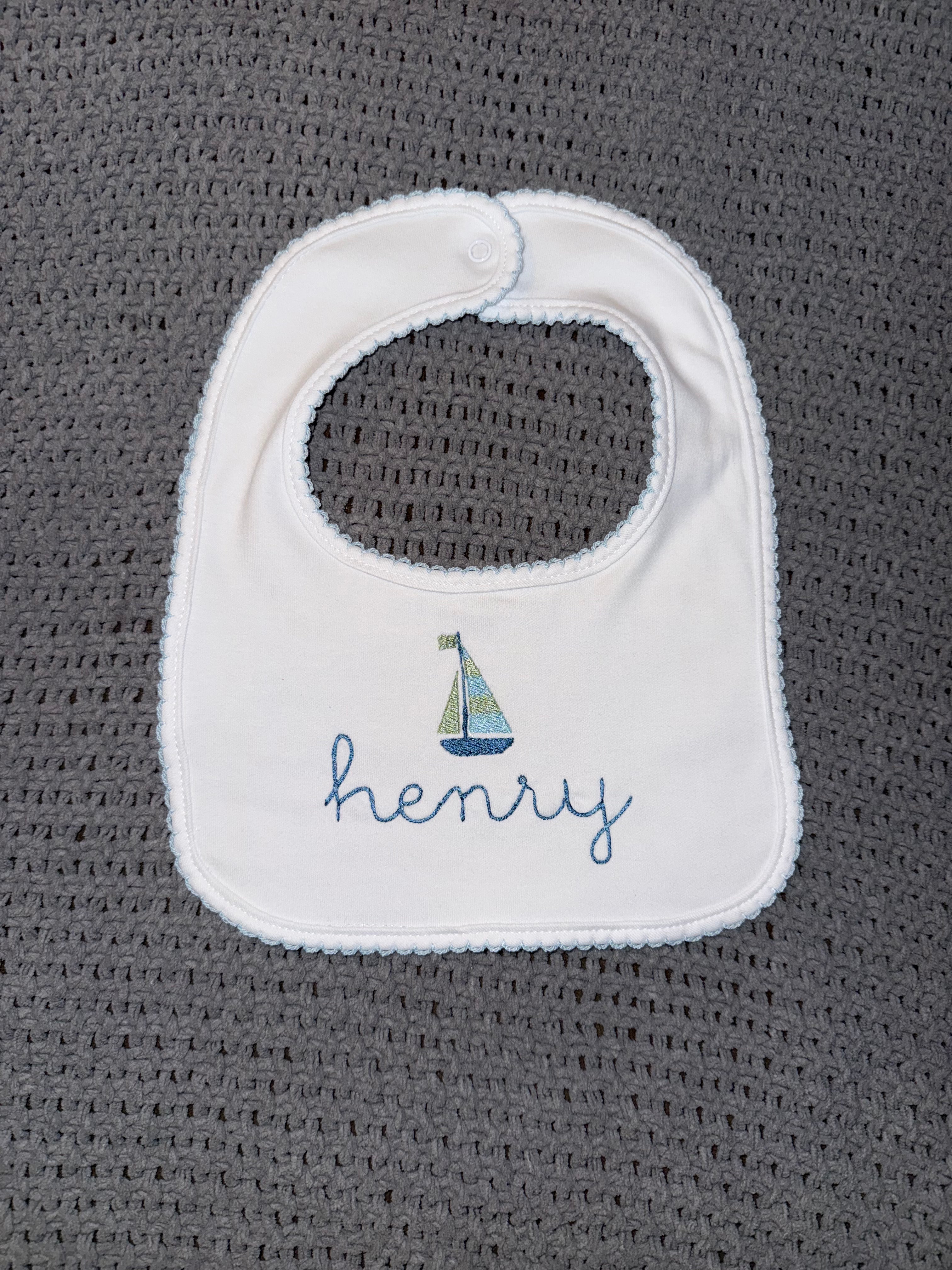blue picot trim bib with monogram