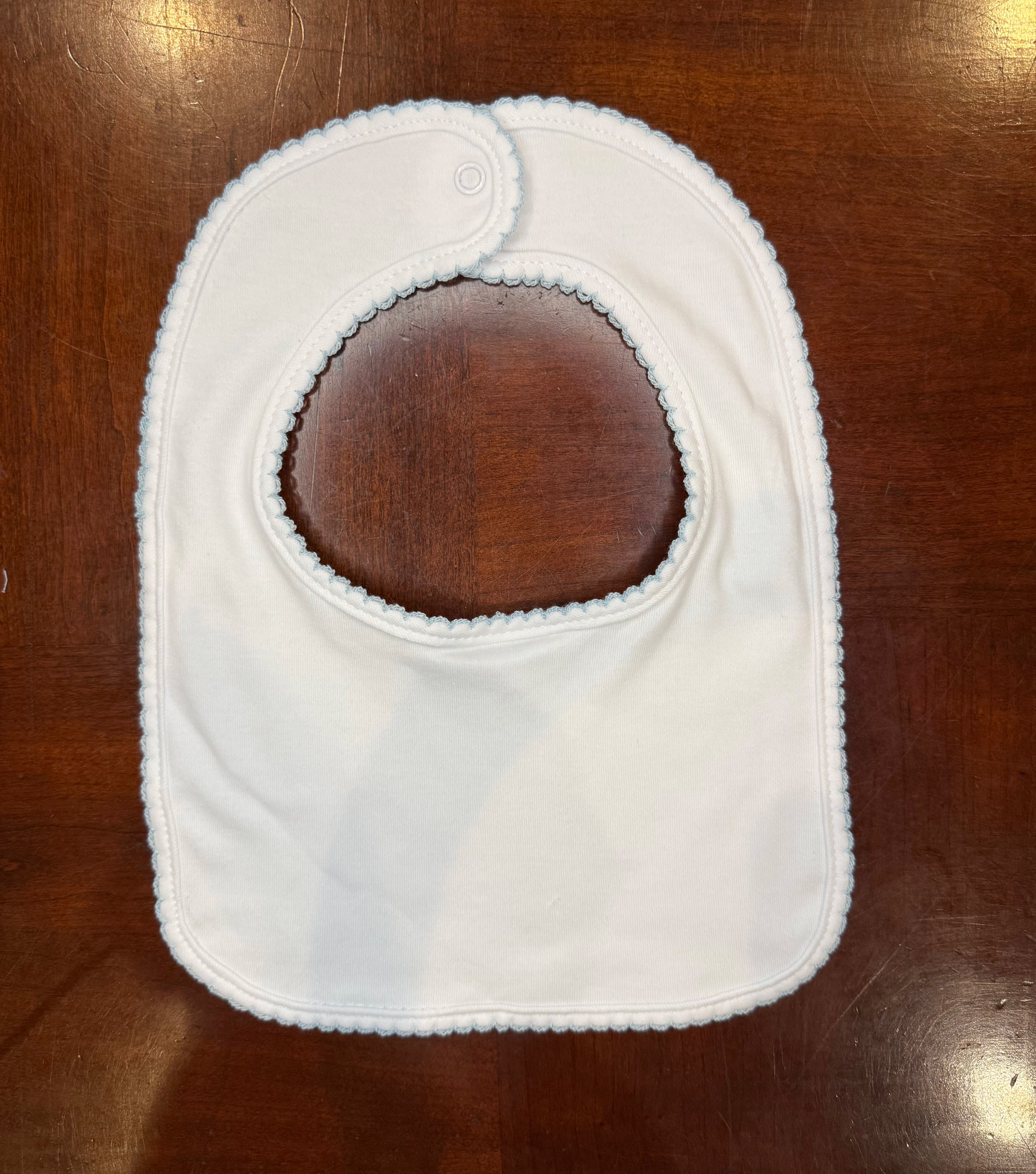 blue picot trim bib with monogram